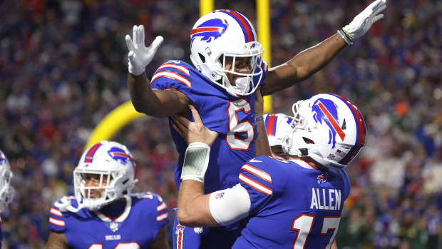 After scoring on a 7 yard touchdown run, Bills receiver Isaiah McKenzie celebrates with Josh Allen.